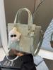 Bolso pequeño popular de este año para mujer 2025 primavera nueva moda bolso bandolera de hombro tendencia de textura bolso de cubo portátil