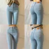 Pantalones de mezclilla azul claro elásticos de talle alto estilo europeo y americano de talla grande para mujer, ajustados, con efecto adelgazante, tipo lápiz que cubren los glúteos para pies pequeños