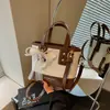 Bolso cubeta de colores contrastantes popular de este año para mujer 2026 nuevo bolso de mano de textura de alta calidad bolso de hombro bolso cruzado para ir al trabajo