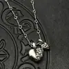 Joyería de moda Plata tailandesa Retro Corazón de doble melocotón Collar de tumba Cadena de suéter Otoño e Invierno Personalizado de Europa y América Cruz de Alta Gama