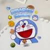 Lindas Pegatinas para Taza de Agua de Doraemon Adhesivo Plano Lindo Personaje Azul Gordito Pegatinas para Funda de Teléfono DIY Accesorios Versión Q