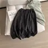 Adaptabilidad desde el Color Beige Diseño Suave, Falda de Retazos de Cintura Alta de Longitud Media Texturizada E018
