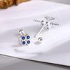 Pendientes de botón de flor exquisitos estilo coreano lujo ligero moda diamante circón azul elegantes pendientes de botón versátiles suministro de comercio exterior