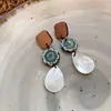 Pendientes de Ganchos para Orejas con Colgante Redondo Geométrico de Ratán y Cuentas de Madera Aguja Plateada Estilo Étnico Vintage Accesorios Únicos para Orejas Sensación de Gama Alta de Nicho