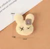 Nuevo Punto Mayorista Felpa Flor de Cinco Pétalos Cabeza de Conejo Linda Dibujos Animados Accesorios Decoración Sombreros, Zapatos y Calcetines para Niños