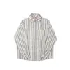 Camisa de manga larga a rayas versátil de primavera y otoño, fina, estilo japonés, fresca y artística, para hombre, holgada y casual para usar como prenda exterior