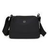 Bolsa feminina transversal 2024 outono nova urbana simples impermeável bolsa de ombro de tecido de náilon casual leve bolsa feminina