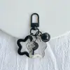 Estrella Hueca de Cinco Puntas Acrílica Campana Hebilla de Puerta de Llave Llavero Cabeza de Bolso Cubierta de Auriculares Colgante Pequeño Decorativo Joyería Colorido