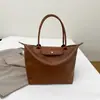 Bolso de Hombro Casual de Gran Capacidad para Mujer 2025 Nuevo Bolso de Mano Sencillo para Viajes Portátil Bolso Tote de Axila