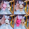 Máquina de peluches de garra máquina de peluches muñeca lanzamiento boda muñeca pequeña peluche colgante juguete ramo muñeca regalo mayoreo