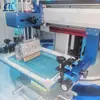 Máquina de Impresión Automática Haotian Máquina de Serigrafía Mesa Plana de Serigrafía Máquina de Impresión de Tapas para Loncheras Máquina de Serigrafía Personalizada de Dos Colores