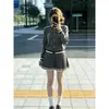 Conjunto de outfit súper popular para mujer para otoño e invierno, nuevo look universitario estilo coreano, conjunto de dos piezas de suéter de punto gris y falda