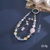 Nuevo colgante de manzana y mariposa con cuentas hecho a mano para teléfono, con un toque de alta gama, charm de cadena doble para bolso, cadena para colgar el teléfono, regalo
