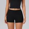 Pantalones cortos de yoga ecológicos de poliéster-spandex reciclado empalmados para mujer, de cintura alta, levanta glúteos, ajustados, de tres cuartos, pantalones cortos deportivos de fitness en stock