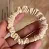 Versión coreana de anillo de pelo negro de alta elasticidad, anillo plisado para el intestino grueso, cola de caballo, cuerda para el cabello, cuerda para la cabeza que combina con todo, banda de goma para mujer