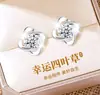 Pendientes de botón de trébol de cuatro hojas giratorio de plata pura s999 seleccionada cuidadosamente, simples, elegantes, atmosféricos, sensación de alta gama