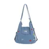 Nova bolsa de ombro e transversal de tecido lavável de grande capacidade transfronteiriça para mulheres, bolsa de ombro fofa totalmente bordada, bolsa transversal de jeans