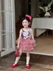 Ropa Infantil Estilo Coreano Nuevo Estilo Verano 2026, Conjunto de Pantalones con Falda de Pastel a Cuadros, Chaleco Camiseta sin Mangas de Dibujos Animados Lindos para Niñas