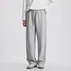 Calça de moletom larga da moda com listras laterais prensadas para homens, outono, caimento solto, versátil, estilo Q, calça lanterna de camada de ar