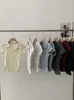 Camiseta de Manga Corta con Cuello Polo Omalai para Mujer Primavera y Verano Nuevo Estilo Plisada Cintura Ajustada Top Corto 5978