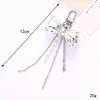 Nuevo colgante de manzana y mariposa con cuentas hecho a mano para teléfono, con un toque de alta gama, charm de cadena doble para bolso, cadena para colgar el teléfono, regalo