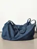 Celebridad de Internet Mismo Estilo Primavera y Verano Mezclilla Commuter Bolso Tote de Gran Capacidad Diseño Moderno Portátil Bolso de Hombro para Mujer