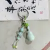 Chaveiro de Maçã de Cerâmica Jingdezhen Estilo Étnico Bolsa Tecida Pendurador Barraca de Feira Noturna Artística Pequenos Acessórios Atacado em Estoque