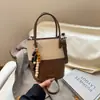 Bolso Cubo de Mujer Más Vendido Transfronterizo 2026 Nuevo Bolso de Hombro Versátil con Bloques de Color, Sensación de Alta Gama y Bolso Cruzado de Lujo Ligero