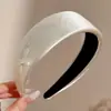 Diadema retorcida fresca y elegante, de lujo ligero para mujer, adecuada para el uso diario en primavera y verano, diadema de ala ancha, dulce accesorio para el cabello estilo coreano