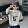 Sudadera con Capucha de Manga Larga para Niños Primavera y Otoño Nuevo Estilo 2026 Ropa de Otoño Infantil Camisa Polo Deportiva Estilo Coreano para Niños Top Fresco y Atractivo