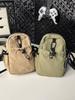 Bolsa de Tela de Nailon Pequeña y Ligera para Mujer 2025 Nuevo Estilo Bolsa Casual Simple para Exterior Bandolera de un Hombro Bolsa para Teléfono Móvil