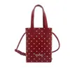 Linda mini bolsa de lunares femenina color caramelo fresco 2026 nueva versátil casual bandolera para teléfono