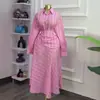 Moda Europeia e Americana Transfronteiriça Feminina Verão 2026 Nova Moda Conjunto de Camisa de Manga Longa Listrada Slim-Fit com Saia de Cintura Alta