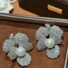 Pendientes de Flor de Zircón y Perla de Aguja Plateada Pendientes de Lujo Pesados Exagerados Transfronterizos Europeos y Americanos con un Diseño Único para Mujer