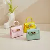 Mini bolso Kelly brillante para mujer, bolso de mano de charol de alta gama, bolso de cadena para hombro y cruzado de lujo ligero y exquisito