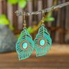 Aretes pop transfronterizos Bohemios de aleación hueca geométricos vintage tallados con cuentas de arroz aretes de borla para mujer