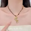 Collar con colgante de luna dorada estilo vintage para mujer, accesorio de cadena larga trenzada para suéter retro de alta gama