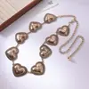 Elegante y Estilosa Cadena de Cintura Metálica con Corazón Turquesa para Mujer