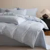 Estilo de lujo ligero juego de cuatro piezas de bordado jacquard 100% algodón puro funda nórdica de algodón de fibra larga sábana bajera ropa de cama para dormitorio principal