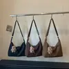 Bolsa feminina de grande capacidade 2026 novo estilo nicho versátil para o dia a dia bolsa tote super moderna casual de ombro transversal