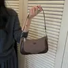 Bolso de axila de nicho de alto valor para mujer 2026 nuevo elegante versátil bolso cruzado bolso pequeño chic para llevar a mano bolso de mezclilla