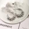 Joyería Xuping Acero Inoxidable Aretes Simples Moda Europea y Americana Personalidad Forma C Bambú Trenzado Corazón Aretes de Botón para Mujer