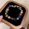 [Cadena de Diamantes Arcoíris] Pulsera de extracción de zircón trenzado en cruz, una pulsera lujosa y de alta gama, una pieza de joyería delicada y de moda