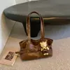 Bolso tote de diseño de nicho estilo coreano transfronterizo con decoración de cinturón, nueva moda, simple y adecuado para ir al trabajo, bolso de hombro y bolso de axila