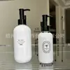 Traje blanco de porcelana 120ml máquina de embarque portátil 500ml botella de salón de belleza botella de aceite desmaquillante tónico
