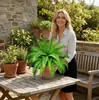 Venta al por mayor de plantas verdes, helechos, hierba persa de 18 cabezas, hojas artificiales, flores artificiales de plástico, decoraciones de pared de plantas, decoraciones de boda