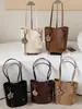 Bolsa de Mano Tejida Shuai Mijia para Mujer 2026 Nuevo Bolso Cubo de Verano Alta Apariencia Temperamento de Nicho Bolso de Hombro Simple
