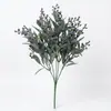Manojo de enredaderas artificiales integradas de eucalipto y flor de camelia al por mayor para fabricantes transfronterizos, para colgar en la pared, decoración de pared verde y arreglos florales para vallas