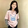 Camiseta de manga larga para niña de algodón puro, nuevo modelo 2026, cuello redondo dulce y lindo, efecto de dos piezas, top versátil para bebés en primavera y otoño