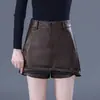 Pantalones cortos de mujer sencillos y elegantes 2026 otoño e invierno nueva tendencia ropa exterior pantalones de falda de cuero elegantes para la oficina pantalones de falda de pierna ancha línea A